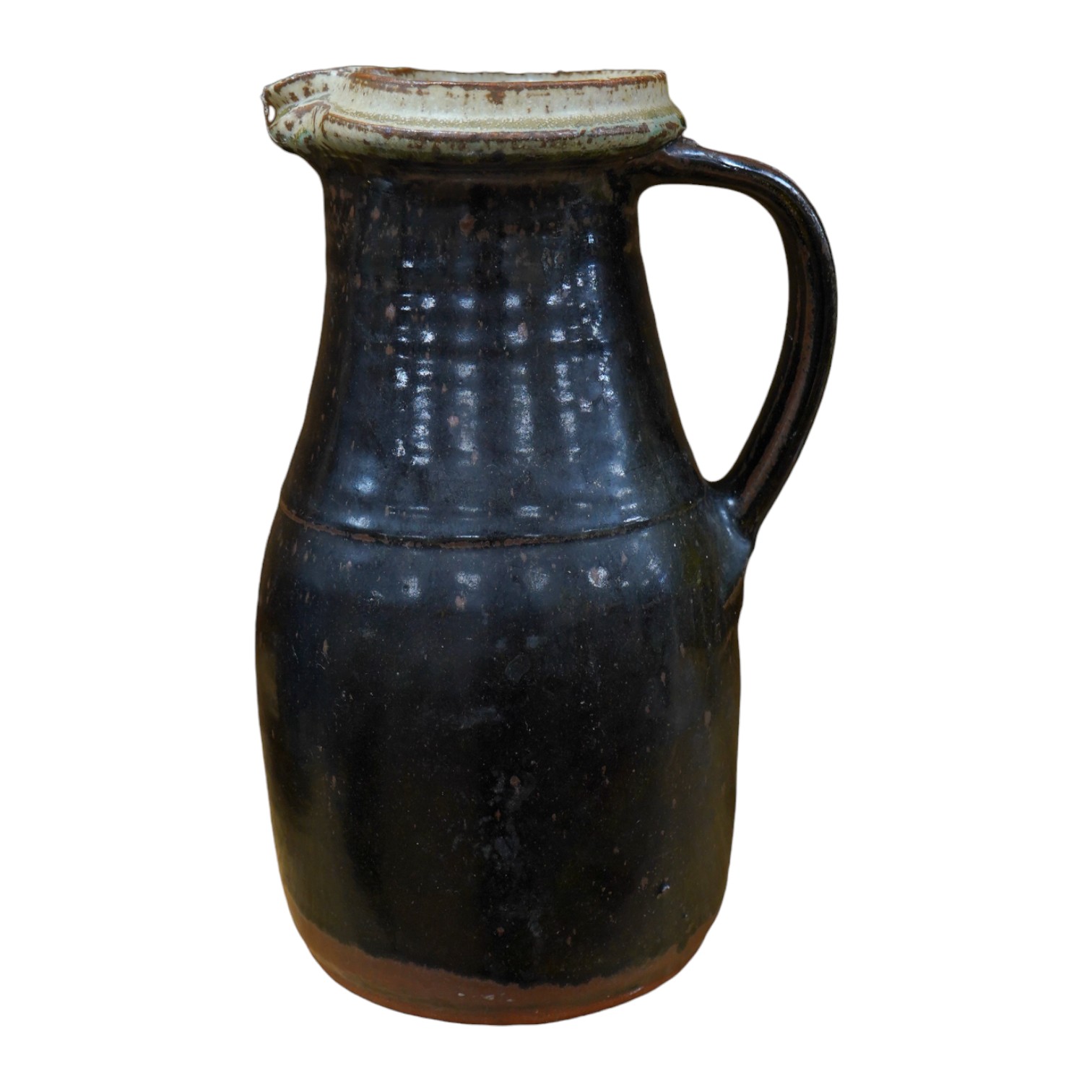 Richard Batterham (1936-2021), a tall stoneware black glazed jug, with a cream rim. 28cm high. Condition - good